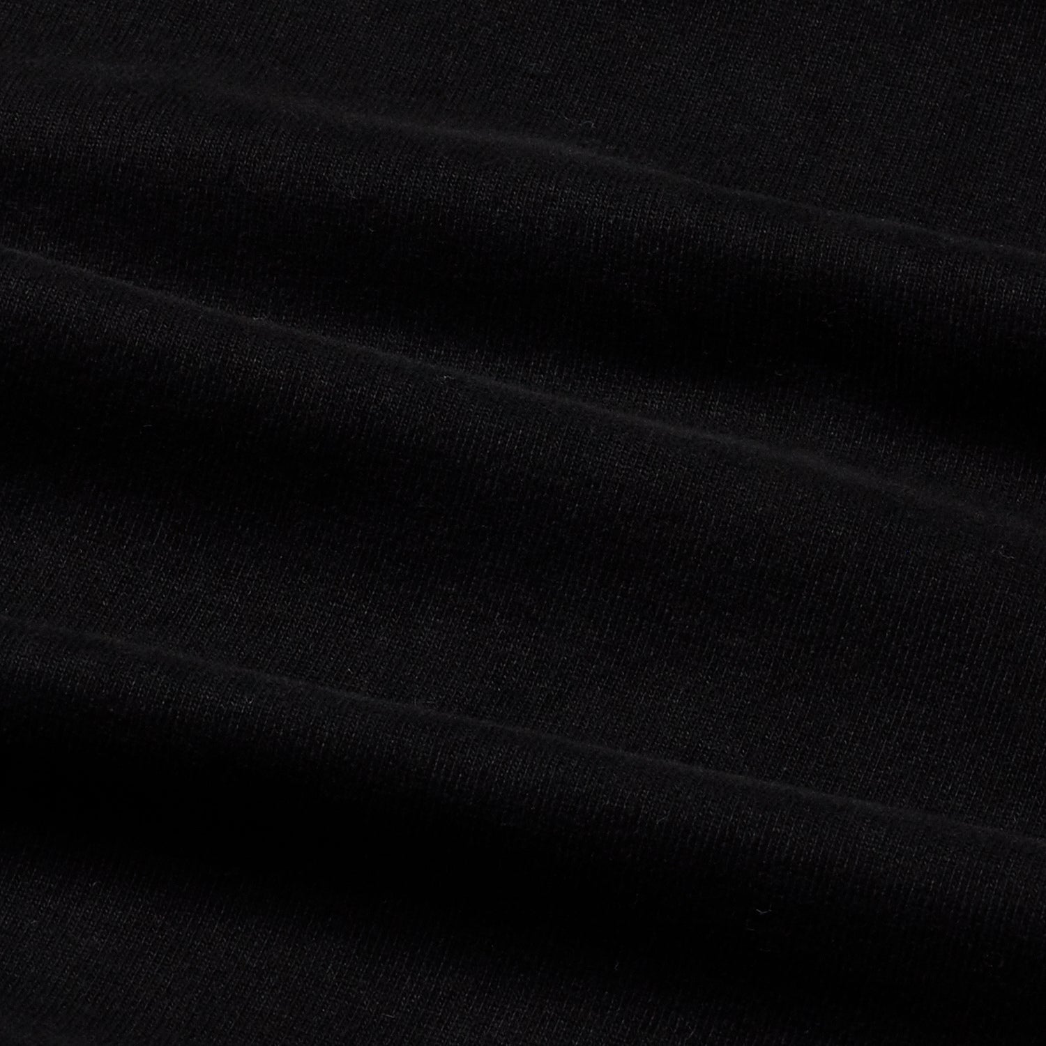 Close-up of the black t-shirt's fabric texture.